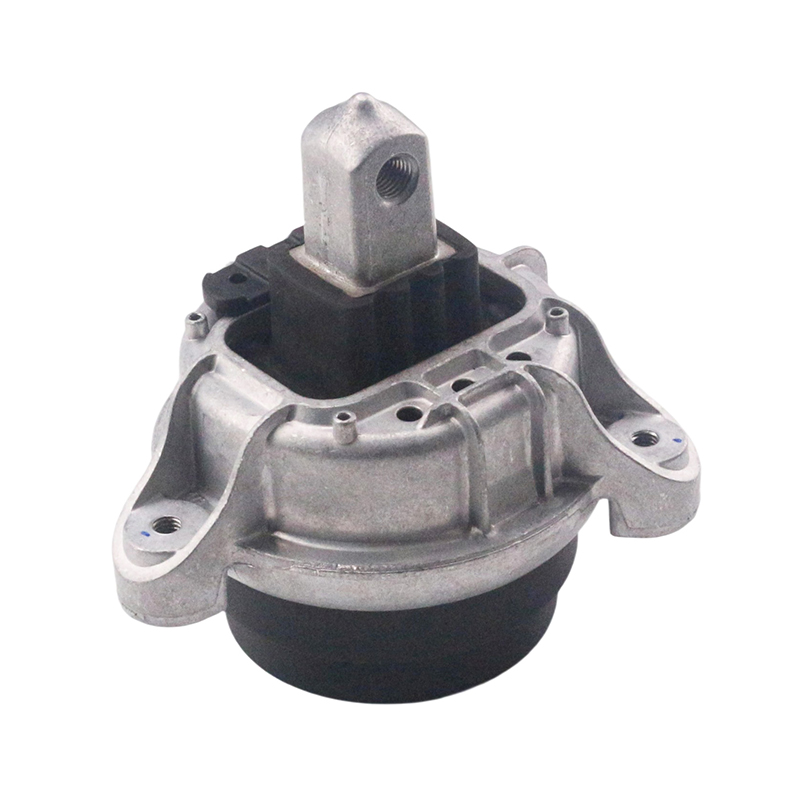 How does an automobile engine suspension effectively reduce the transmission of engine vibration to the vehicle body, improving ride comfort?